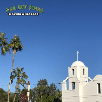 palm trees and white church against a blue sky in tempe